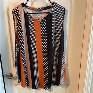 New never worn. No tags. Beautiful bright sleeveless top. Casual